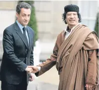  ??  ?? Nicolas Sarkozy, left, with Muammar Gaddafi.