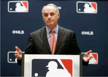  ?? AP Photo/LM Otero ?? In this 2019 file photo, baseball commission­er Rob Manfred speaks to the media at the owners meeting in Arlington, Texas.