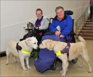 ??  ?? Nice to Meet You....John Morgan with his new assistance dog ‘Jamie’ get to meet Tracey Lee and her dog ‘Derry’. Picture: Ken Finegan