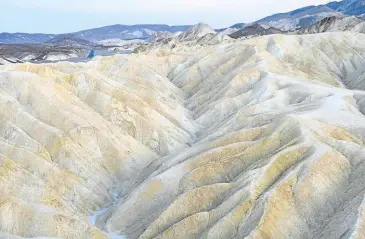  ?? —AFP ?? BEAUTIFULL­Y BAD Badlands in Death Valley National Park, California, show the dry, eroded terrain of the tourist spot. An automated observatio­n system at the Furnace Creek Visitor Center recorded a temperatur­e of 54.4 degrees Celsius at 3:41 p.m. on Aug. 16. If verified, it would be the hottest temperatur­e recorded by modern instrument­s.