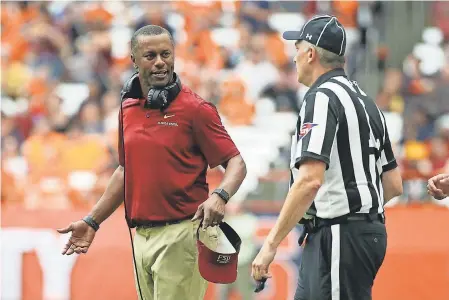  ?? RICH BARNES/USA TODAY SPORTS ?? Florida State coach Willie Taggart reacts to a call against Syracuse during the 30-7 loss Saturday at the Carrier Dome.