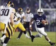  ?? CHRIS KNIGHT — THE ASSOCIATED PRESS ?? Penn State running back Miles Sanders (24) carries the ball against Iowa during the second half of Saturday’s game in State College, Pa. Penn State won 30-24.