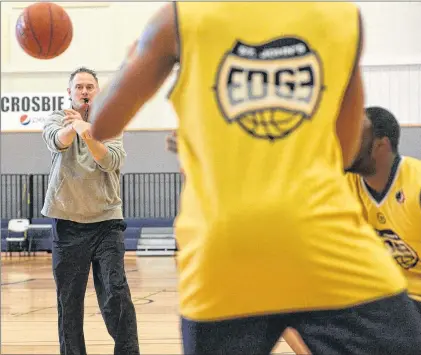  ?? JOE GIBBONS/THE TELEGRAM ?? St. John’s Edge coach Jeff Dunlap runs his charges through workouts at the team’s training this week at the Newfoundla­nd and Labrador Sports Centre.