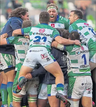  ?? ?? Benetton celebrate their victory over Glasgow in Treviso yesterday