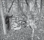  ?? STEVE FAGIN/SPECIAL TO THE DAY ?? A cairn is among many stone structures scattered through the Perry Natural Area.