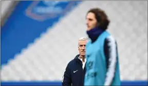  ??  ?? Didier Deschamps (au second plan) a critiqué le choix d’Adrien Rabiot.