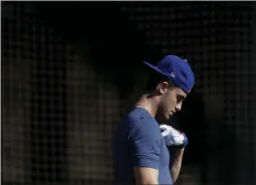  ?? GREGORY BULL - THE ASSOCIATED PRESS ?? Los Angeles Dodgers center fielder Cody Bellinger leaves the batting cages during spring training baseball Friday, Feb. 14, 2020, in Phoenix.