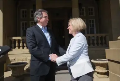  ?? AMBER BRACKEN/THE CANADIAN PRESS ?? Former Alberta premier Jim Prentice and premier-designate Rachel Notley met in Edmonton last week. Prentice chose to pander to Big Oil instead of standing up to it and his PC party was soundly defeated in the May 5 election.