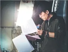  ??  ?? Zhang Yimou is studying the script of ‘The Great Wall’ in an undated photo.