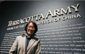  ?? STEVE HELBER — THE ASSOCIATED PRESS ?? In a Tuesday photo, Li Jian, curator of the Terracotta Army soldiers on exhibit at the Virginia Museum of Fine Arts, poses at the start of the exhibit at the museum in