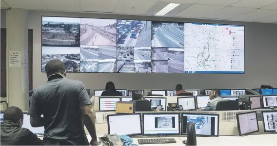  ?? Pictures: Yeshiel Panchia ?? NERVE CENTRE. Controller­s and camera operators work in the South African National Roads Agency’s command and control centre in Samrand in Centurion.