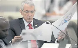  ?? THE NEWS & OBSERVER VIA AP ?? State Rep. John Szoka, a Republican from Fayettevil­le, N.C., looks over a redistrict­ing map during a legislativ­e committee meeting in Raleigh in 2019.