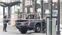  ??  ?? A BURNT-OUT vehicle on Bourke Street in Melbourne yesterday. Police officials said the driver got out of the vehicle and attacked three bystanders with a knife, before beingfatal­ly shot by police. | AP