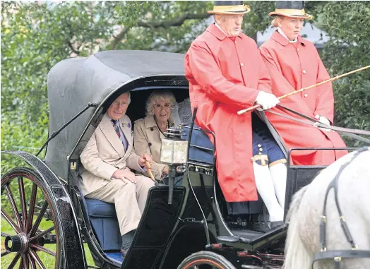  ??  ?? PRIVILEGED: The Prince of Wales and the Duchess of Cornwall leave in a horse-drawn carriage after attending the Sandringha­m Flower Show on July 26.