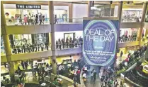  ??  ?? Shoppers line up outside stores in Scottsdale Fashion Square. Steve Helm, Fashion Square property manager, said the mall had twice as many shoppers this year from 8 p.m. Thursday to midnight as it did last year from midnight to 6 a.m. on Black Friday.