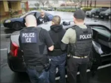  ?? CHARLES REED/U.S. IMMIGRATIO­N AND CUSTOMS ENFORCEMEN­T VIA AP ?? In this photo taken Feb. 7, 2017, released by U.S. Immigratio­n and Customs Enforcemen­t, an arrest is made during a targeted enforcemen­t operation conducted by U.S. Immigratio­n and Customs Enforcemen­t (ICE).