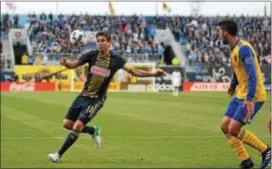  ?? MIKE REEVES — FOR DIGITAL FIRST MEDIA ?? Union midfielder Alejandro Bedoya, left, attacking Colorado Rapids defender Eric Miller in Saturday’s 2-1 win, is one of several players who have raised their level of play in the Union’s four-game winning streak.