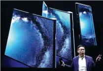  ?? SERGIO PEREZ / REUTERS ?? Yu Chengdong, CEO of Huawei’s consumer business group, unveils Mate X, a foldable 5G-ready smartphone, in Barcelona, Spain, on Sunday.