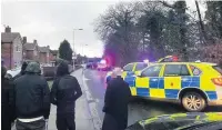  ?? Pic: @joshrathou­r ?? ●●Armed police make an arrest at a house in Heald Green