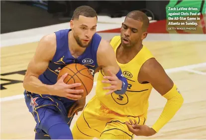  ?? GETTY IMAGES PHOTOS ?? Zach LaVine drives against Chris Paul at the All-Star Game in Atlanta on Sunday.