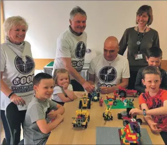  ??  ?? It was all smiles at the launch of the Library Lego Club in Stornoway. Left to right are Janet Paterson and Western Isles Lifestyle Lottery team members Tony Robson and Malcolm Paterson with Helene Lagrange from Stornoway Library and some keen Lego...