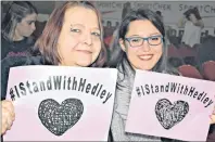  ?? DESIREE ANSTEY/ JOURNAL PIONEER ?? Grace McPhee, from the left, and Kayla Legere were among the fans at the Credit Union Place holding cards reading “#I Stand with Hedley.”