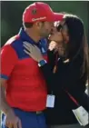  ?? STUART FRANKLIN, GETTY IMAGES ?? Sergio Garcia kisses his fiancée, Angela Akins, at The Open Tuesday.