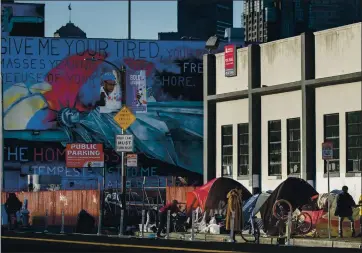  ?? KARL MONDON — STAFF PHOTOGRAPH­ER ?? A community of homeless people pitch their tents on Sixth Street in San Francisco on March 21.