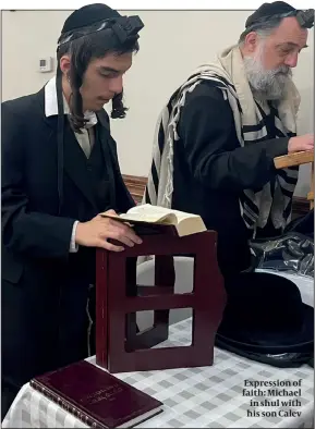 ?? ?? Expression of faith: Michael in shul with his son Calev