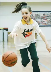  ??  ?? Sadie Rietmuelle­r, nine, was all smiles during the NBL game time clinic.