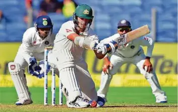  ?? PTI ?? Australia’s Mitchell Starc plays a sweep shot during the first day yesterday. Starc is unbeaten on 57 off 58 balls and also shared a vital unbeaten 51-run partnershi­p with Hazlewood.