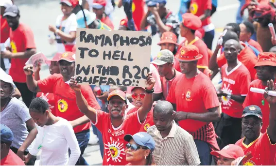  ?? Picture: Michel Bega ?? PAINTING THE TOWN RED. National Union of Metalworke­rs of SA members march yesterday in central Johannesbu­rg against proposed changes to labour laws and the amended national minimum wage.