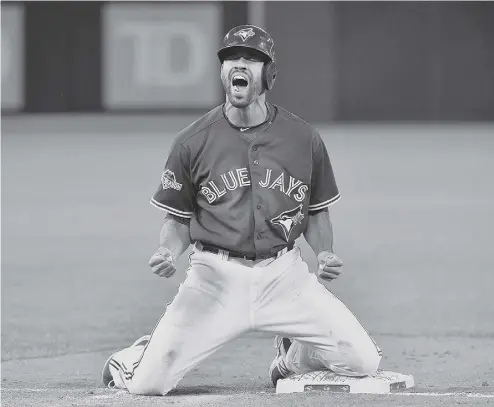  ?? NATHAN DENETTE / THE CANADIAN PRESS FILES ?? Blue Jay Dalton Pompey reacts after stealing third base in game 5 of the American League Division Series in Toronto on Oct. 14. Pompey says fellow Canadian Stubby Clapp gave him solid career advice and support.