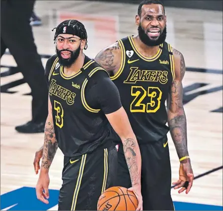  ?? Photog raphs by Wally Skalij Los Angeles Times ?? ANTHONY DAVIS, left, and LeBron James have gotten along swimmingly as Lakers teammates right from the start. “When you have two guys that are self less ... it’s rare you see it,” Davis said. “We know we have something special with us two and this team.”