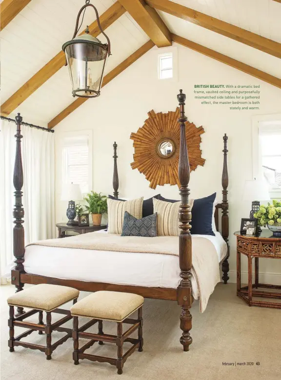  ??  ?? BRITISH BEAUTY. With a dramatic bed frame, vaulted ceiling and purposeful­ly mismatched side tables for a gathered effect, the master bedroom is both
stately and warm.
