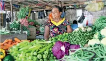  ??  ?? Vegetable traders complained people who bought vegetables in kilos were now buying them only in grams.
Pix by Indika Handuwala