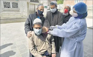  ?? WASEEM ANDRABI/HT PHOTO ?? A man receives a shot of a Covid-19 vaccine in Srinagar on Wednesday.