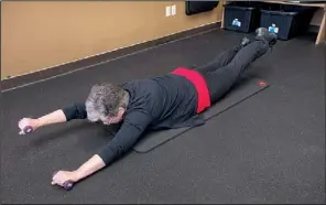  ?? Arkansas Democrat-gazette/karen E. SEGRAVE ?? Linda Walker says the Dry Fish is a good challenge for the lower back and neck muscles; you don’t want to do too much too soon but rather build up your endurance over time.