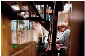  ??  ?? Work of art: A woman working in the laboratory of Antico setificio Fiorentino ancient silk factory in Florence. — AFP