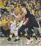  ?? BEN MARGOT/ASSOCIATED PRESS ?? The Warriors’ Stephen Curry, left, drives the ball against his brother, the Trail Blazers’ Seth Curry, during the first half.