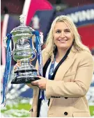  ?? ?? Treble joy: Chelsea manager Emma Hayes with the FA Cup to complete a clean sweep