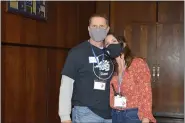  ?? RACHEL RAVINA — MEDIANEWS GROUP ?? Volunteer Mike Frederick and Clinic Coordinato­r Cortney Marengo pose for a photo donning masks Sunday morning inside of North Penn High School during Skippack Pharmacy’s COVID-19vaccinat­ion clinic.