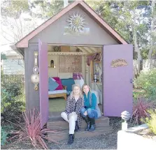  ?? TIMOTHY HAYES ?? Erika Kotite, left, author of She Sheds: A Room of Your Own (Cool Spring Press, 2017), with her sister-in-law in the kit shed they built on her sisterin-law’s property in California.