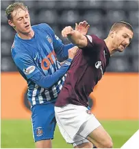  ??  ?? ■ Kilmarnock’s Sean Longstaff and Hearts’ Perry Kitchen clash on Friday night.