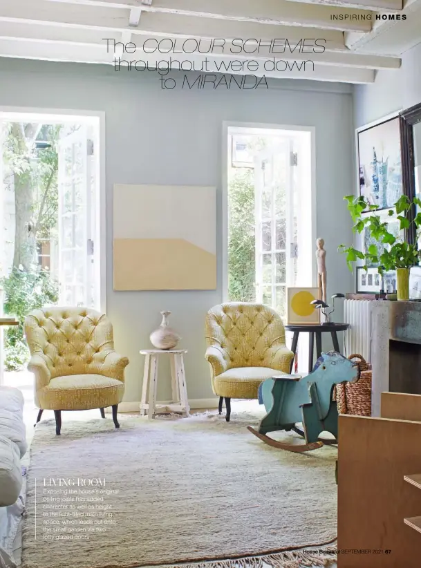  ??  ?? LIVING ROOM Exposing the house’s original ceiling joists has added character as well as height to the light-filled main living space, which leads out onto the small garden via two lofty glazed doors