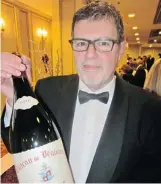  ??  ?? Wine expert Anthony Gismondi singled out a custom three-litre bottle of the 2010 Hommage a Jacques Perrin — estimated at $2,500 — as one of the evening’s prized bottles.