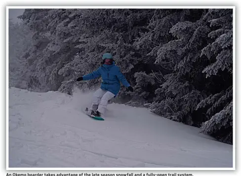  ?? ?? An Okemo boarder takes advantage of the late season snowfall and a fully-open trail system.