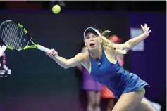  ?? — AFP photo ?? Caroline Wozniacki of Denmark returns the ball to Daria Kasatkina of Russia during her quarter final match as part of the St Petersburg Ladies Trophy 2018 tennis tournament match in Saint Petersburg, on February 2, 2018.