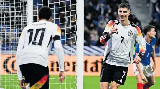  ?? [APA / AFP] ?? Deutschlan­d fand in Lyon wieder seine Leichtigke­it. Havertz (r.) und Musiala machten beim 2:0-Auswärtssi­eg ein starkes Spiel.