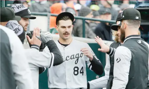  ?? GETTY IMAGES ?? White Sox right-hander Dylan Cease is congratula­ted by teammates after yielding one run and striking out eight in five-plus innings Saturday.